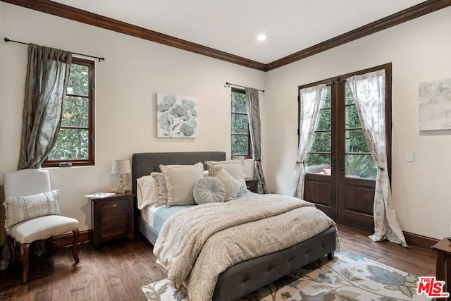 bedroom featuring crown molding, dark wood-type flooring, and french doors