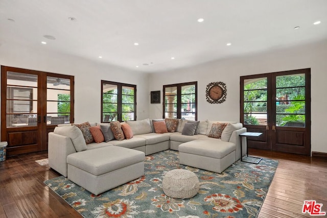 living room with french doors and hardwood / wood-style flooring