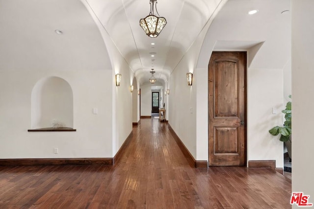 hallway with dark wood-type flooring