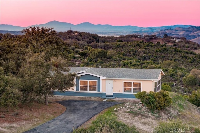 view of front of home with a mountain view