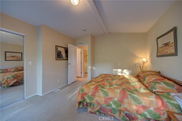 bedroom featuring lofted ceiling with beams and light carpet