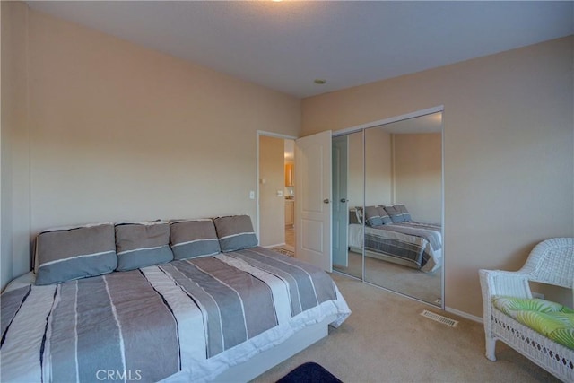 bedroom with carpet flooring and a closet