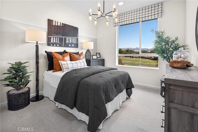 carpeted bedroom featuring a notable chandelier