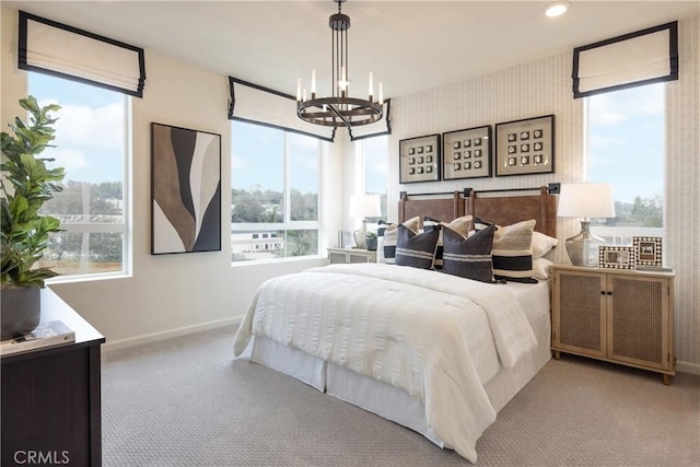 bedroom with multiple windows and light colored carpet