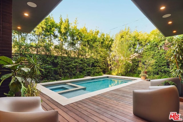 view of swimming pool featuring an in ground hot tub and a wooden deck