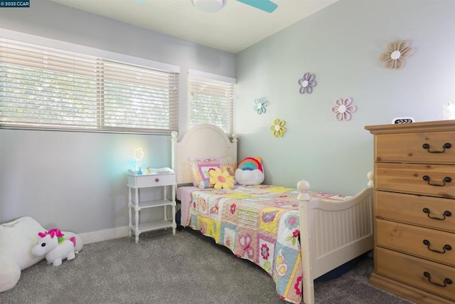 bedroom with ceiling fan and dark colored carpet