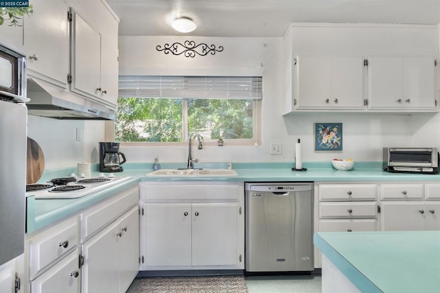 kitchen featuring white electric stovetop, sink, stainless steel dishwasher, and white cabinets