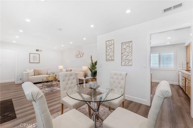 dining space featuring light wood-type flooring