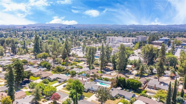 birds eye view of property with a mountain view