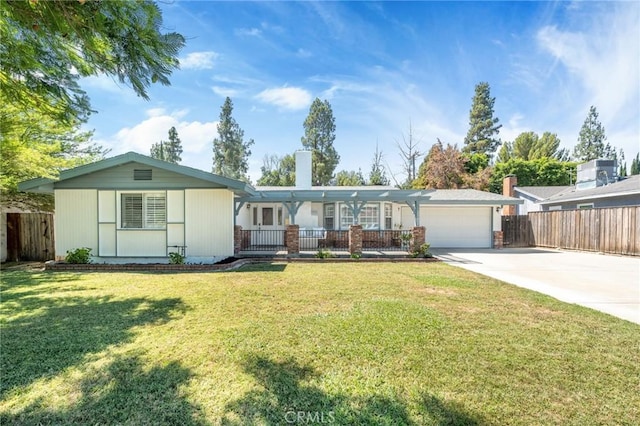 single story home featuring a garage and a front yard