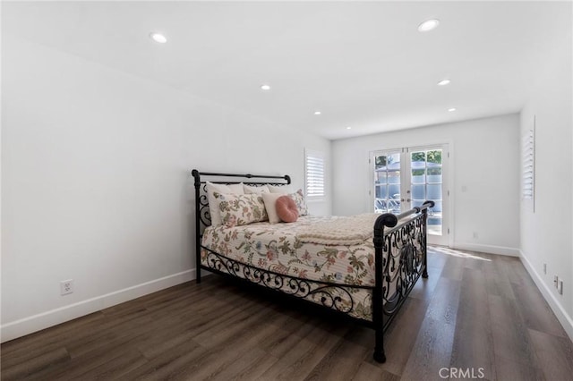 bedroom with dark hardwood / wood-style floors, access to exterior, and french doors