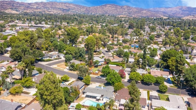 birds eye view of property with a mountain view