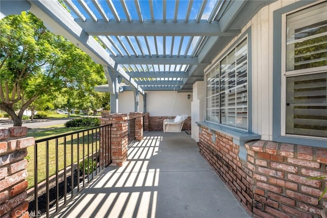 view of patio featuring a pergola and covered porch