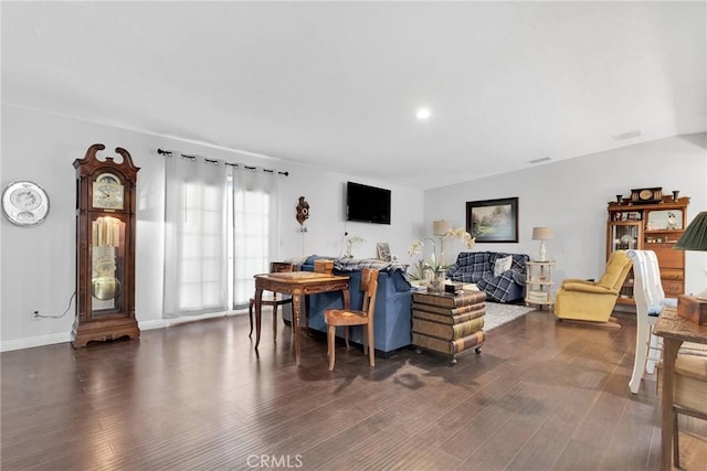 living room with dark hardwood / wood-style flooring