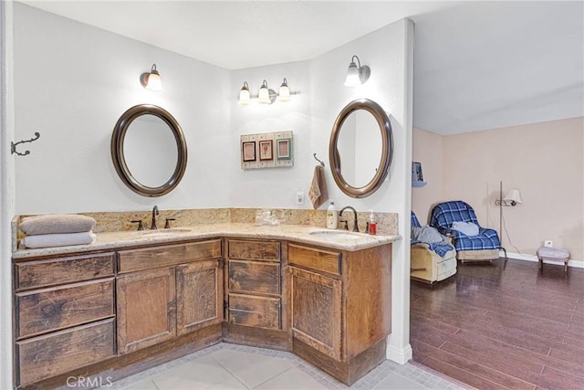 bathroom featuring hardwood / wood-style flooring and vanity