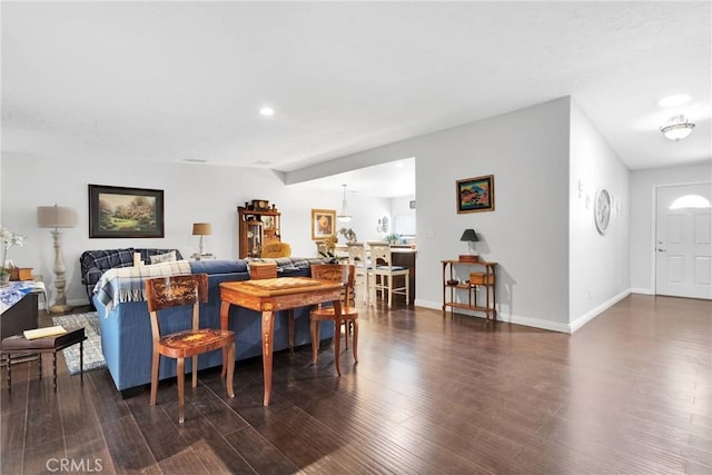 living room featuring dark wood-type flooring