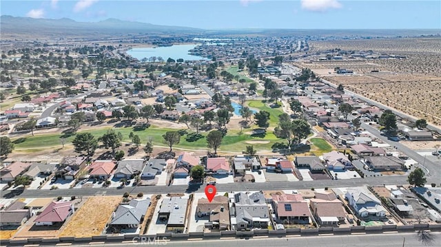 drone / aerial view with a water and mountain view