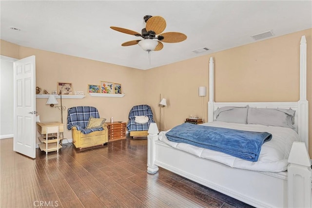 bedroom with dark wood-type flooring and ceiling fan