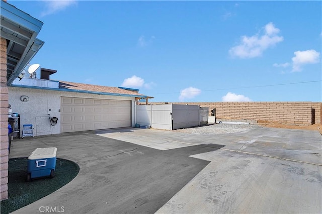 view of patio / terrace featuring a garage