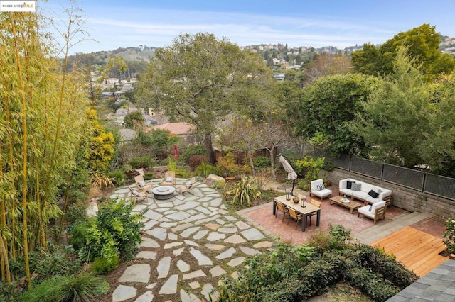 view of patio / terrace featuring an outdoor living space with a fire pit