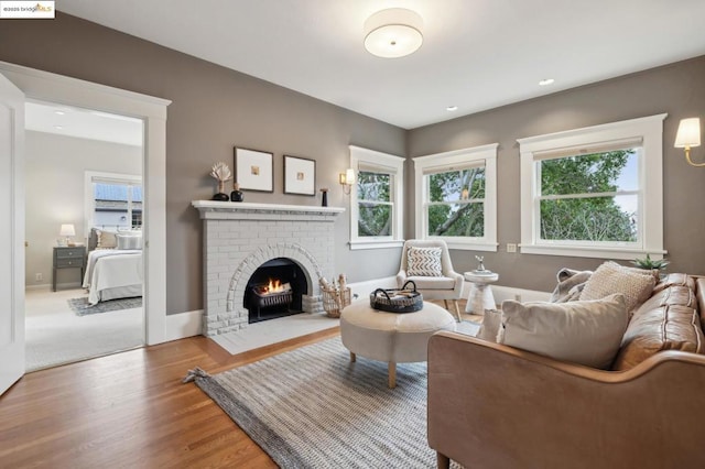 living room featuring hardwood / wood-style floors and a fireplace