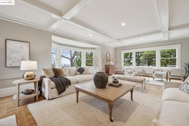 living room with coffered ceiling, beamed ceiling, a wealth of natural light, and light parquet floors