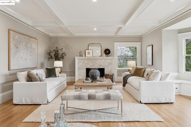 living room featuring coffered ceiling, beam ceiling, and light hardwood / wood-style flooring