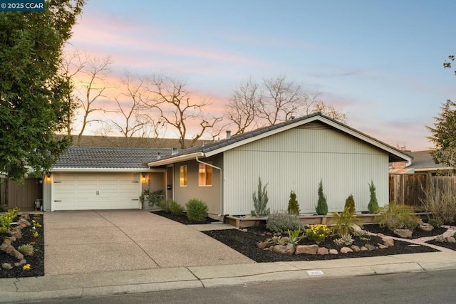 ranch-style home featuring a garage