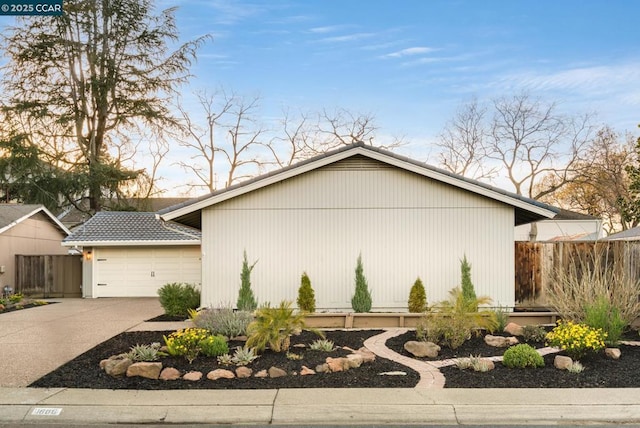 view of side of home featuring a garage