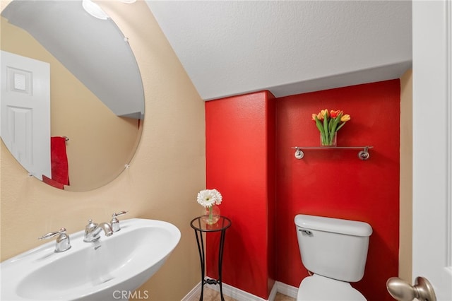 bathroom featuring sink and toilet