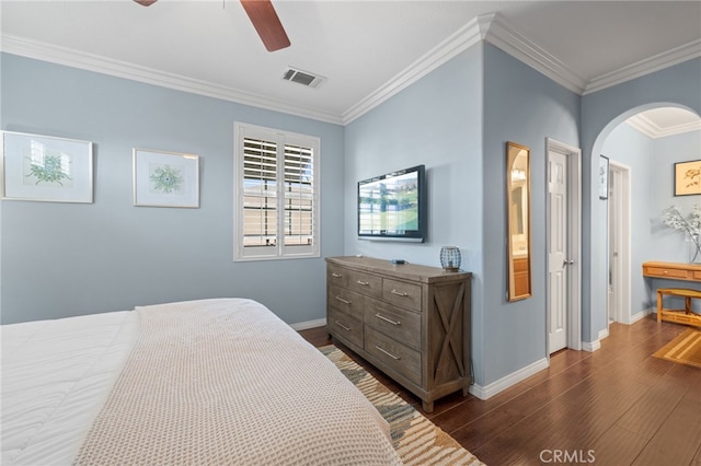 bedroom featuring ceiling fan, ornamental molding, and dark hardwood / wood-style floors