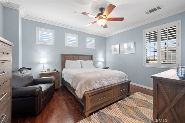 bedroom featuring dark hardwood / wood-style flooring, crown molding, and ceiling fan