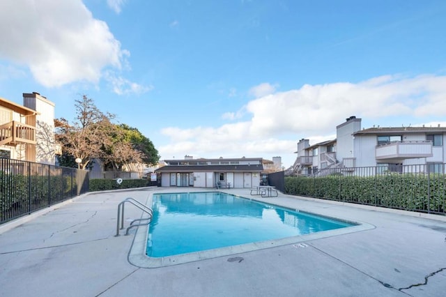 view of pool featuring a patio