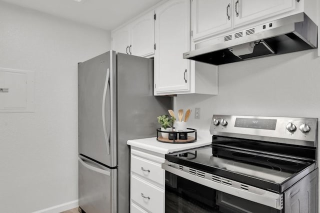 kitchen with stainless steel appliances, white cabinets, and electric panel