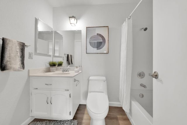 full bathroom with shower / bathtub combination with curtain, vanity, wood-type flooring, and toilet