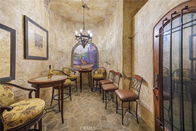 6 Inspiration, Laguna Niguel, CA 92677 - wine cellar with stone flooring, a chandelier, and a textured wall