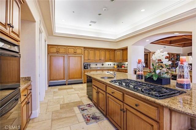 6 Inspiration, Laguna Niguel, CA 92677 - kitchen with black appliances, arched walkways, brown cabinets, light stone countertops, and ornamental molding