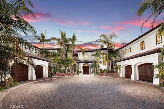 6 Inspiration, Laguna Niguel, CA 92677 - mediterranean / spanish home with curved driveway, a garage, and stucco siding
