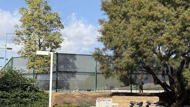 exterior space with tennis court