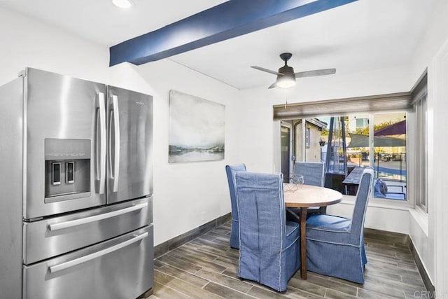 dining room with ceiling fan and beam ceiling