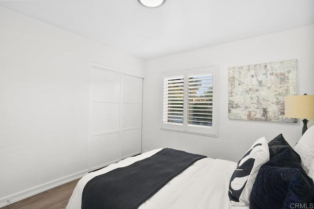 bedroom featuring dark hardwood / wood-style floors