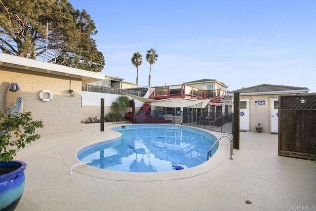 view of swimming pool with a patio area