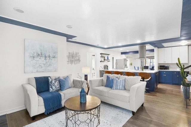 living room with dark hardwood / wood-style flooring