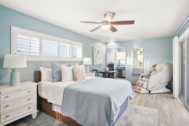 bedroom with ceiling fan and light hardwood / wood-style flooring