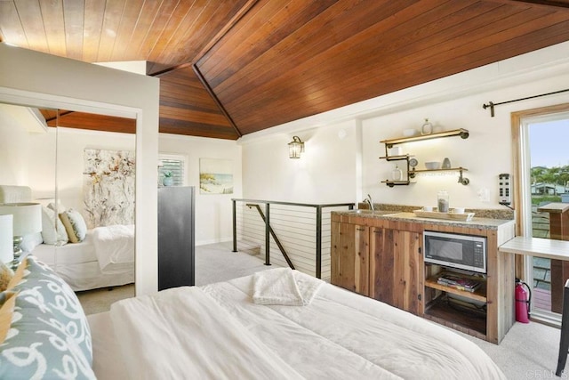 bedroom with lofted ceiling, sink, light carpet, and wooden ceiling