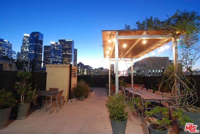 view of patio terrace at dusk