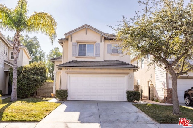 front of property with a garage