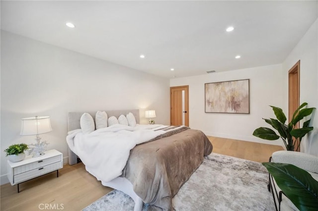 bedroom with light hardwood / wood-style floors