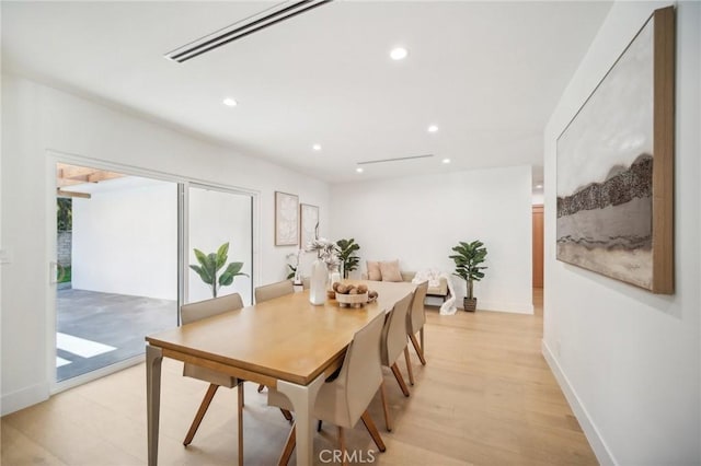 dining area with light hardwood / wood-style flooring