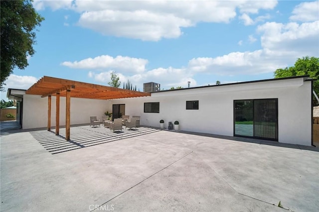 back of property with a patio and a pergola